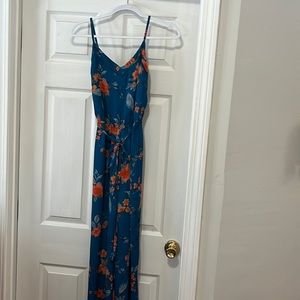 Beautiful blue flowered jumpsuit extra small brand is skies are blue